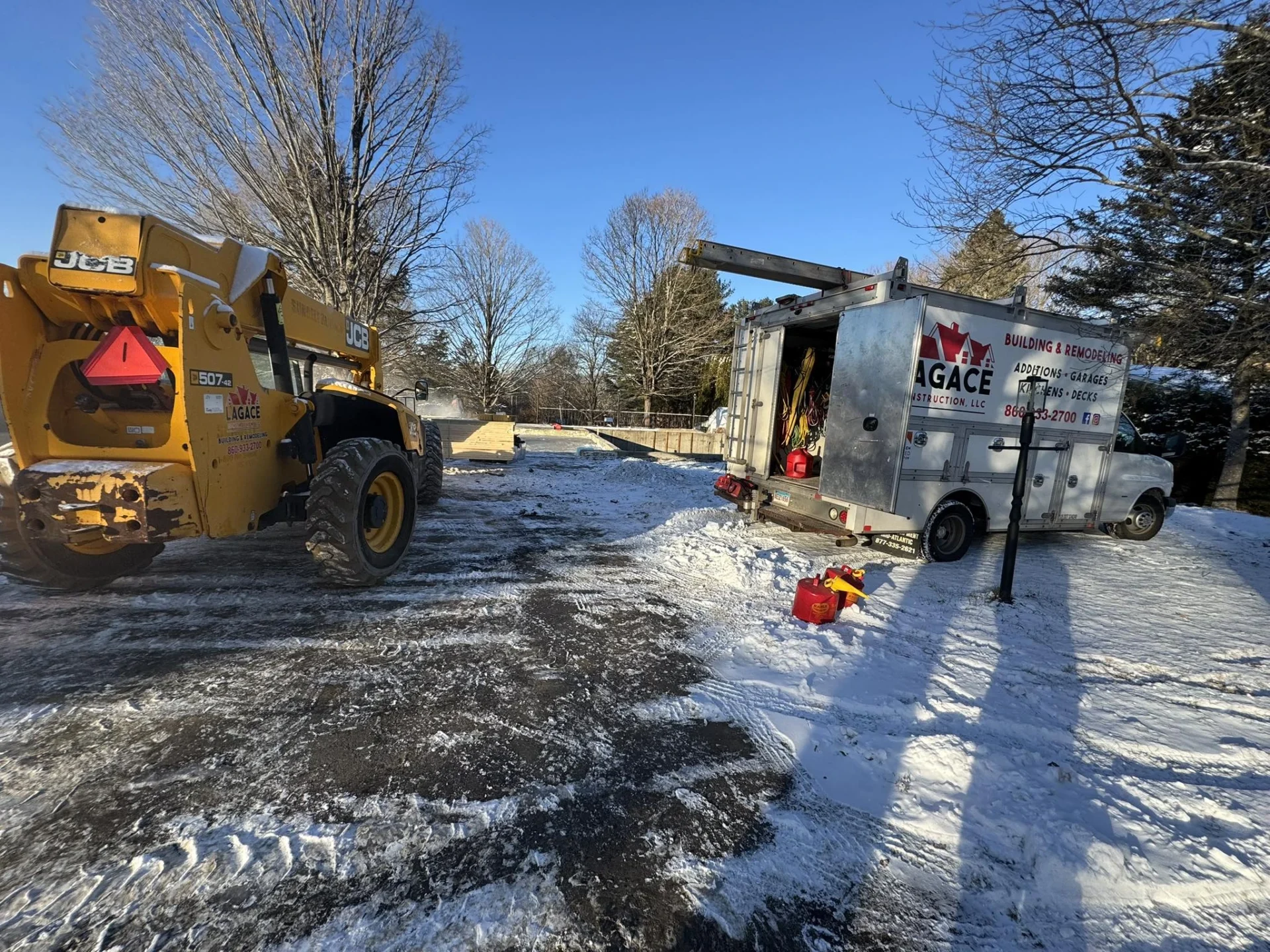 Lagace Construction crew working on a new home addition in Coventry, CT during winter.